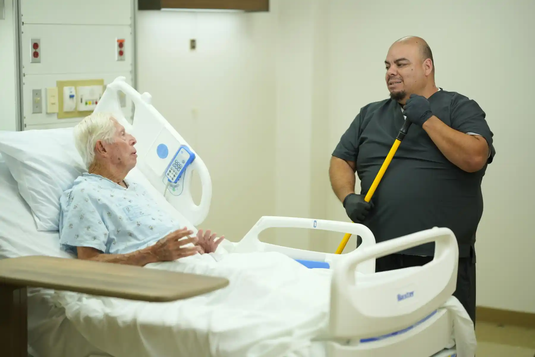 Floor cleaning EVS tech in hospital