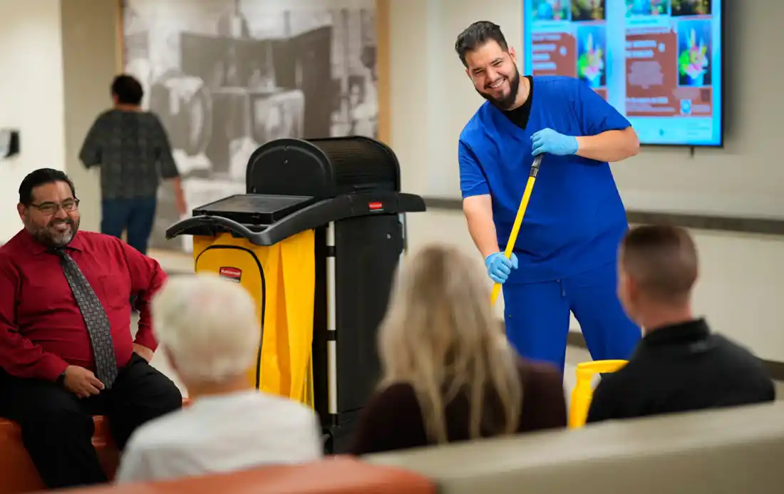 EVS Technician in a hospital waiting area